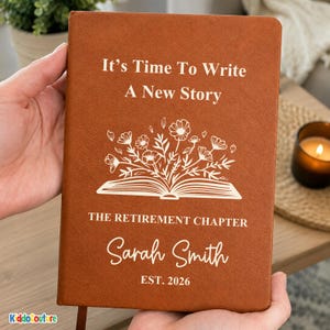 May include: A rust-colored notebook with a textured cover featuring white text that reads It's Time To Write A New Story, THE RETIREMENT CHAPTER, Sarah Smith, and EST. 2026, along with a graphic of an open book with flowers emerging from it.