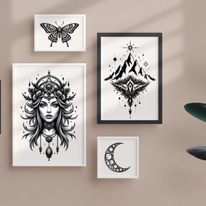 May include: A collection of framed black and white art prints. The prints feature various designs, including a butterfly, a woman's portrait, an elephant, a mountain scene, and a crescent moon. The frames are white and black, displayed on a neutral-colored wall.
