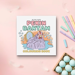 May include: A square coloring book with the text "IN THE COOP PEKIN BANTAM COLOURING BOOK" features a cartoon chicken in a bathtub with a mirror. The book is on a pink background with pastel pens and a box of blue eggs.