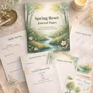 May include: A collection of spring-themed journal pages and a journal titled "Spring Reset Journal Pages". The journal pages include prompts for reflection, gratitude, and fresh starts. A lit candle and floral accents complete the scene.