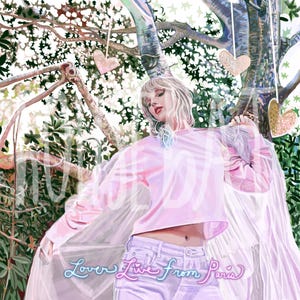 May include: A woman in a pink crop top and white jeans stands in front of a tree with pink and gold hearts hanging from the branches. The text "Lover Live from Paris" is written in neon pink and blue letters at the bottom of the image.