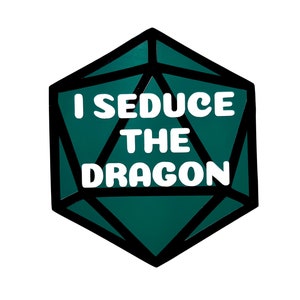 May include: A teal and black d20 die with the text "I Seduce The Dragon" in white. The die is a polyhedral shape, commonly used in tabletop role-playing games. The design is simple and bold, with a clear font.