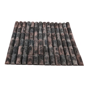 May include: A close-up of a brown and black tile roof made of small, cylindrical tiles. The tiles are arranged in a staggered pattern, creating a textured surface.