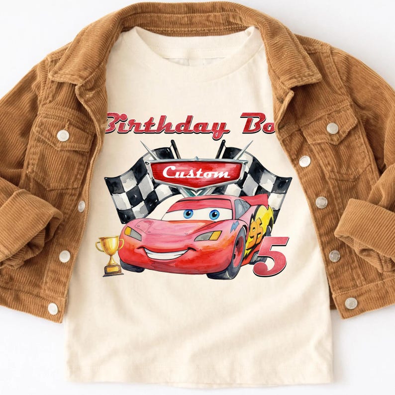 May include: A white ceramic mug with a black handle and the text "But First, Coffee" in a bold, black font. The mug is sitting on a wooden surface. The mug appears to be empty.