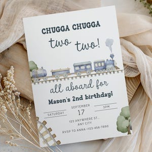 May include: A white invitation card with the text "CHUGGA CHUGGA two two!" and "all aboard for Mason's 2nd birthday!" A watercolor train illustration in blue and gray decorates the top. The date is September 17th, Saturday, at 3 PM.