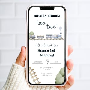 May include: A smartphone displays a birthday invitation with a train theme. The text reads "CHUGGA CHUGGA two two!" and "all aboard for Mason's 2nd birthday!" Details include date, time, and RSVP information. Watercolor train illustration.