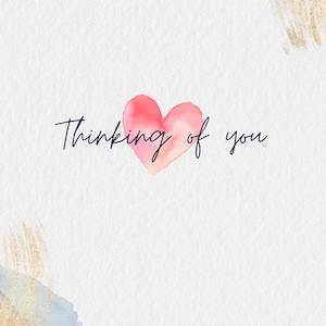 May include: A white background with watercolor accents in gold, blue, and peach. A pink watercolor heart is centered, with the words "Thinking of you" in elegant script above it. A simple, heartfelt design.