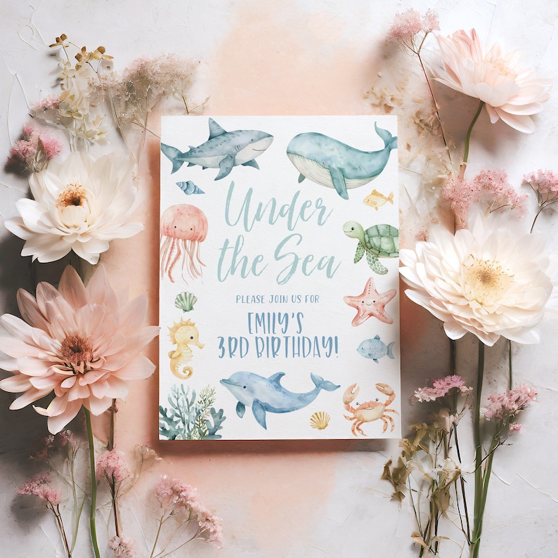May include: Under the Sea themed birthday party invitation with watercolour illustrations of a shark, whale, jellyfish, seahorse, turtle, starfish, fish, crab, and dolphin. The invitation says "Please join us for Emily's 3rd Birthday!"