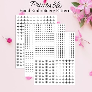 May include: Three white printable hand embroidery pattern sheets with black stitch designs, including crosses, asterisks, and dashed lines. The text "Printable Hand Embroidery Patterns" is at the top. Pink flowers and petals are in the background.