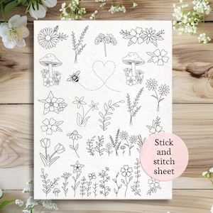 May include: A black and white stick and stitch sheet featuring various floral and botanical designs. The sheet includes illustrations of flowers, mushrooms, bees, and leaves. The text "Stick and stitch sheet" is on a pink circle.