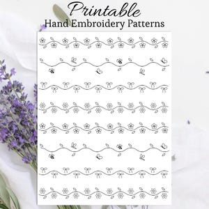 May include: A white printable sheet featuring hand embroidery patterns. Designs include flowers, bows, bees, and butterflies. The text "Printable Hand Embroidery Patterns" is displayed in a script font.