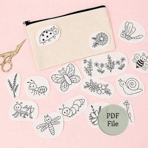 May include: A beige canvas zipper pouch accompanied by various white fabric patches featuring black line art illustrations of insects, flowers, and a snail. A pair of gold-toned stork scissors is positioned to the left, and a circular PDF File icon.
