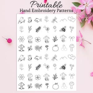 May include: A white sheet with the text "Printable Hand Embroidery Patterns" in black script. The sheet features various black line art designs of birds, flowers, mushrooms, insects, and other nature-themed elements.
