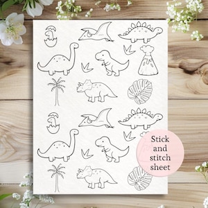 May include: A white stick and stitch sheet featuring various dinosaur illustrations in black outline. The sheet includes images of a long-necked dinosaur, a T-Rex, a Triceratops, a Pterodactyl, a volcano, and palm trees.
