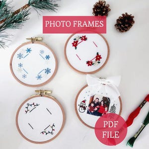May include: Four round embroidery hoop photo frames with white fabric and wooden hoops. Designs include snowflakes, red flowers, Christmas lights, and a family photo. The text "PHOTO FRAMES" and "PDF FILE" are visible.