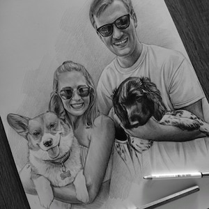 May include: A graphite pencil drawing on white paper depicting two people wearing sunglasses, each holding a dog. One dog is a Corgi with a bone-shaped tag, and the other is a spaniel-type dog. Two drawing pencils are placed on the paper.
