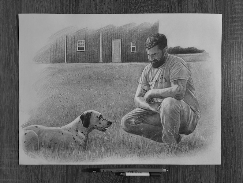 May include: A graphite pencil drawing on paper depicting a bearded individual crouching in a grassy field next to a spotted dog. In the background, a barn with a door and two windows is visible. Two pencils are placed horizontally below the artwork.