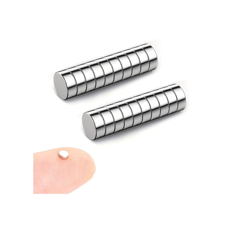 May include: Two cylindrical silver magnets with a segmented design are shown. A small, round magnet rests on a fingertip, demonstrating the size. These magnets are likely for crafts, science projects, or industrial applications.