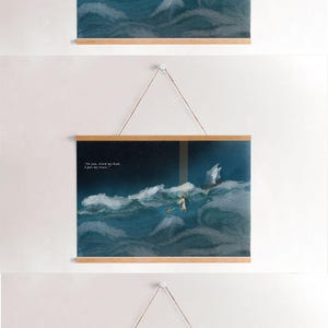 May include: Three framed art prints with wooden hangers. The prints depict a person in a white robe walking on water, with a boat in the distance, set against a backdrop of a stormy sea. The text "In you, Lord my God, I put my trust." is visible.