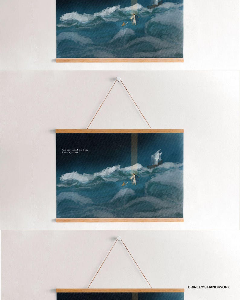 May include: Three framed art prints with wooden hangers. The prints depict a person in a white robe walking on water, with a boat in the distance, set against a backdrop of a stormy sea. The text "In you, Lord my God, I put my trust." is visible.