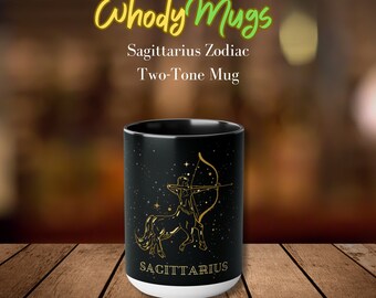May include: Black and white two-tone ceramic mug with a gold Sagittarius zodiac symbol and the text "SAGITTARIUS". The mug is 15 ounces.
