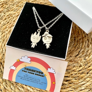 Feel the bond with our Friendship Necklace, crafted in silver stainless steel. The set includes two pendants: one embodies a flame, radiating warmth, and the other mirrors water, signifying depth and fluidity.
