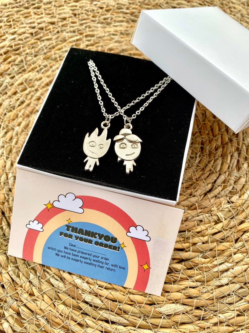 Feel the bond with our Friendship Necklace, crafted in silver stainless steel. The set includes two pendants: one embodies a flame, radiating warmth, and the other mirrors water, signifying depth and fluidity.