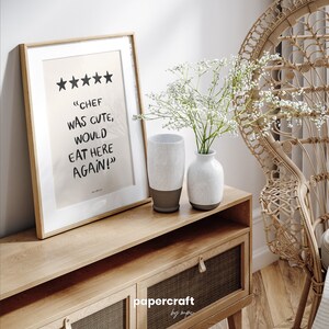 Poster with a funny phrase about food. It is in a dining room frame. Color beige and black. Funny quote about food. Aesthetic wall art poster.