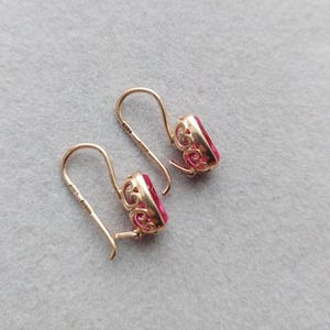 Vintage delicate gold earrings with red stone