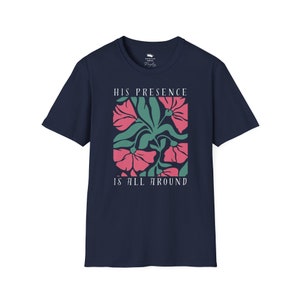 High-quality soft-style t-shirt made with ethically grown cotton. Beautiful floral graphic with a stylish font that says His presence is all around. Color navy.