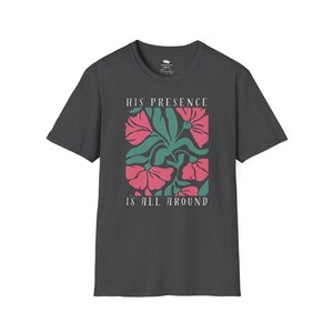 High-quality soft-style t-shirt made with ethically grown cotton. Beautiful floral graphic with a stylish font that says His presence is all around. Color dark heather grey.