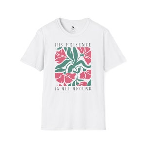 High-quality soft-style t-shirt made with ethically grown cotton. Beautiful floral graphic with a stylish font that says His presence is all around. Color white.