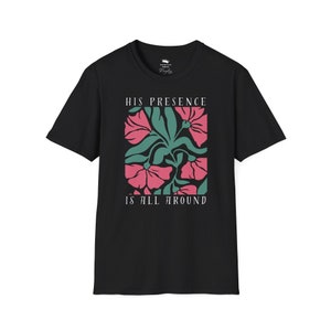 High-quality soft-style t-shirt made with ethically grown cotton. Beautiful floral graphic with a stylish font that says His presence is all around. Color black.