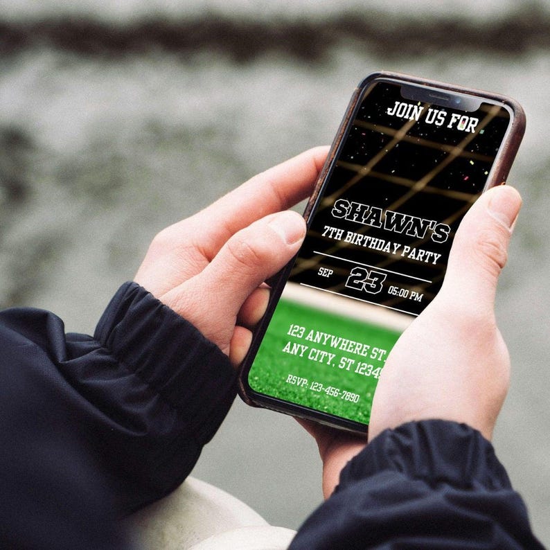 A person's hands holding a smartphone displaying an invitation for a Shawn's 7th birthday party.