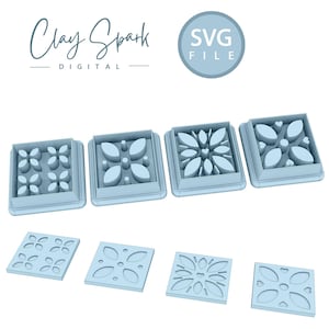 May include: Four light blue plastic square cookie cutters with different geometric designs. The cutters are arranged in a row from left to right. The designs are a simple floral pattern, a more intricate floral pattern, a starburst pattern, and a pattern with hearts and leaves.