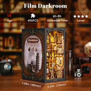 May include: A 3D wooden puzzle model of a film darkroom, with a vintage aesthetic. The model is 7.09 inches wide, 9.06 inches tall, and 4.33 inches deep. The puzzle has 405 pieces and is recommended for ages 14 and up. It takes 6 to 8 hours to assemble and is rated as a challenging puzzle.