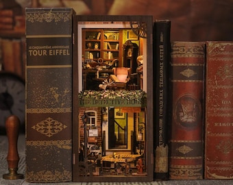 May include: A miniature wooden model of a detective's house with a sign that reads "The Detective House". The model is displayed on a shelf with other books.