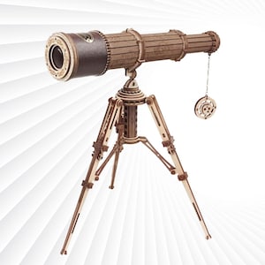 May include: A wooden telescope model with a brown leather-like covering on the barrel. The telescope is mounted on a wooden tripod with intricate details. The tripod has three legs that extend out from a central column.