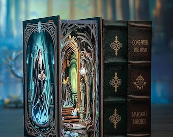 Puede incluir: Un libro decorativo con una escena pop-up 3D de un mago de pie en un bosque. El libro está encuadernado en cuero marrón con detalles dorados y el título "Lo que el viento se llevó" de Margaret Mitchell está impreso en el lomo.