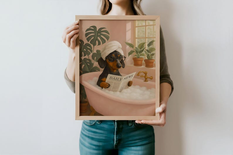 May include: Framed art print featuring a dachshund in a bathtub, wearing a towel and glasses, reading a newspaper. The print has a pink and green color scheme, with plants and a window in the background. The newspaper reads "DAILY NEWS".