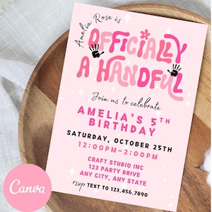 May include: A pink birthday invitation with the text "Amelia Rose is Officially a Handful." The invitation includes details for Amelia's 5th birthday, including the date, time, and location. The Canva logo is in the bottom left corner.