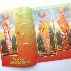 May include: A magazine cover with the title "India misteriosa" and three images of women carrying clay pots on their heads. The women are wearing colorful traditional clothing and are standing in front of a green background.
