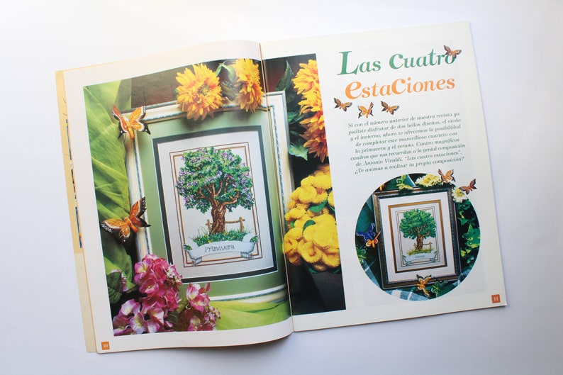 May include: A magazine page with a cross-stitch pattern of a tree with a banner that reads "Primavera". The page is surrounded by sunflowers, butterflies, and a floral arrangement. The text "Las Cuatro Estaciones" is at the top of the page.