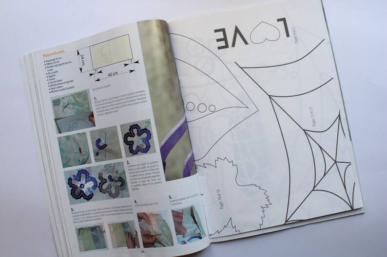 May include: A black and white craft project with instructions for making a flower and a spider web. The project includes a template for the flower and spider web, as well as instructions on how to cut and assemble the pieces. The project is titled "Fournitures" and includes the text "LOVE" and "Pages 14t 15" and "Pages 12 13".