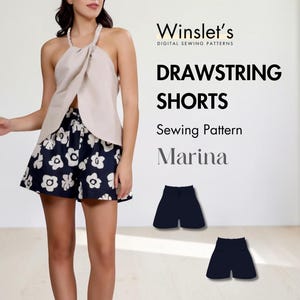 May include: A woman wearing a beige halter top and navy shorts with white floral patterns. The image includes text that reads "DRAWSTRING SHORTS Sewing Pattern Marina" and two examples of the shorts.