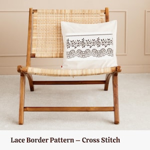 May include: A white cushion with a black lace border pattern on a wooden chair. The cushion is decorated with a cross stitch design. "Lace Border Pattern - Cross Stitch" is written below the chair.