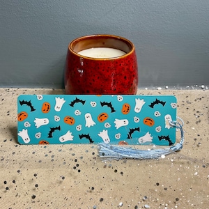 Halloween-bladwijzer met kwastje: handgemaakt gelamineerd cadeau voor boekenliefhebbers.