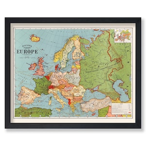 May include: Framed vintage map of Europe, featuring a detailed depiction of countries and geographical features. The map, titled "Bacon's Standard Map of Europe," is in a black frame and displays a variety of colors, including green, yellow, and red.