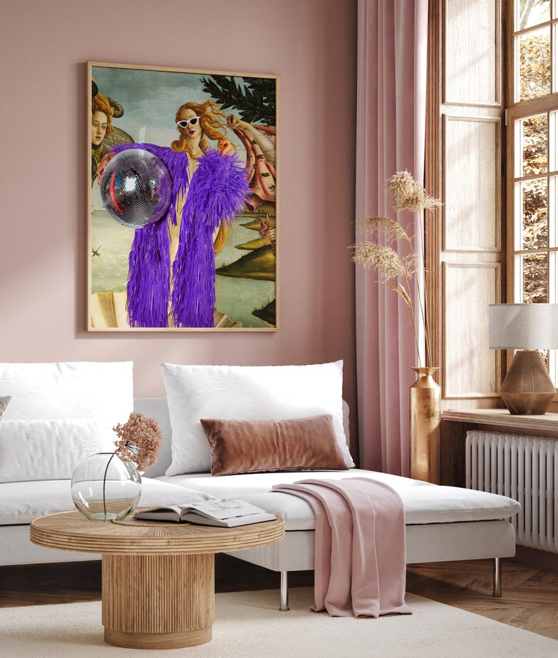 a living room with a couch and a painting on the wall