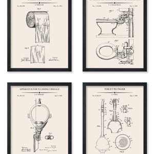 May include: Set of four framed patent prints featuring vintage bathroom fixture designs. Includes a toilet paper roll, toilet, urinal, and plunger, all in black and white on a cream background. Each print is in a black frame.